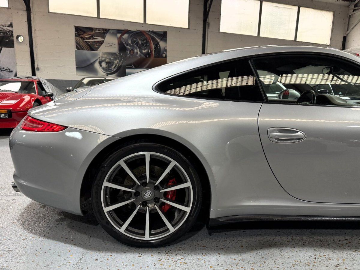 Porsche 991 Carrera 4S 2013 — vue arriere trois-quarts (12)