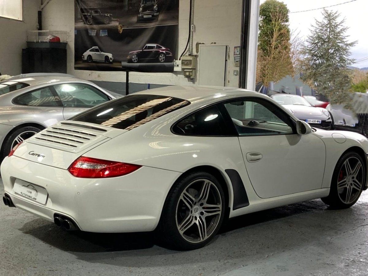 Porsche 997 Carrera 2009 — vue arriere trois-quarts (11)