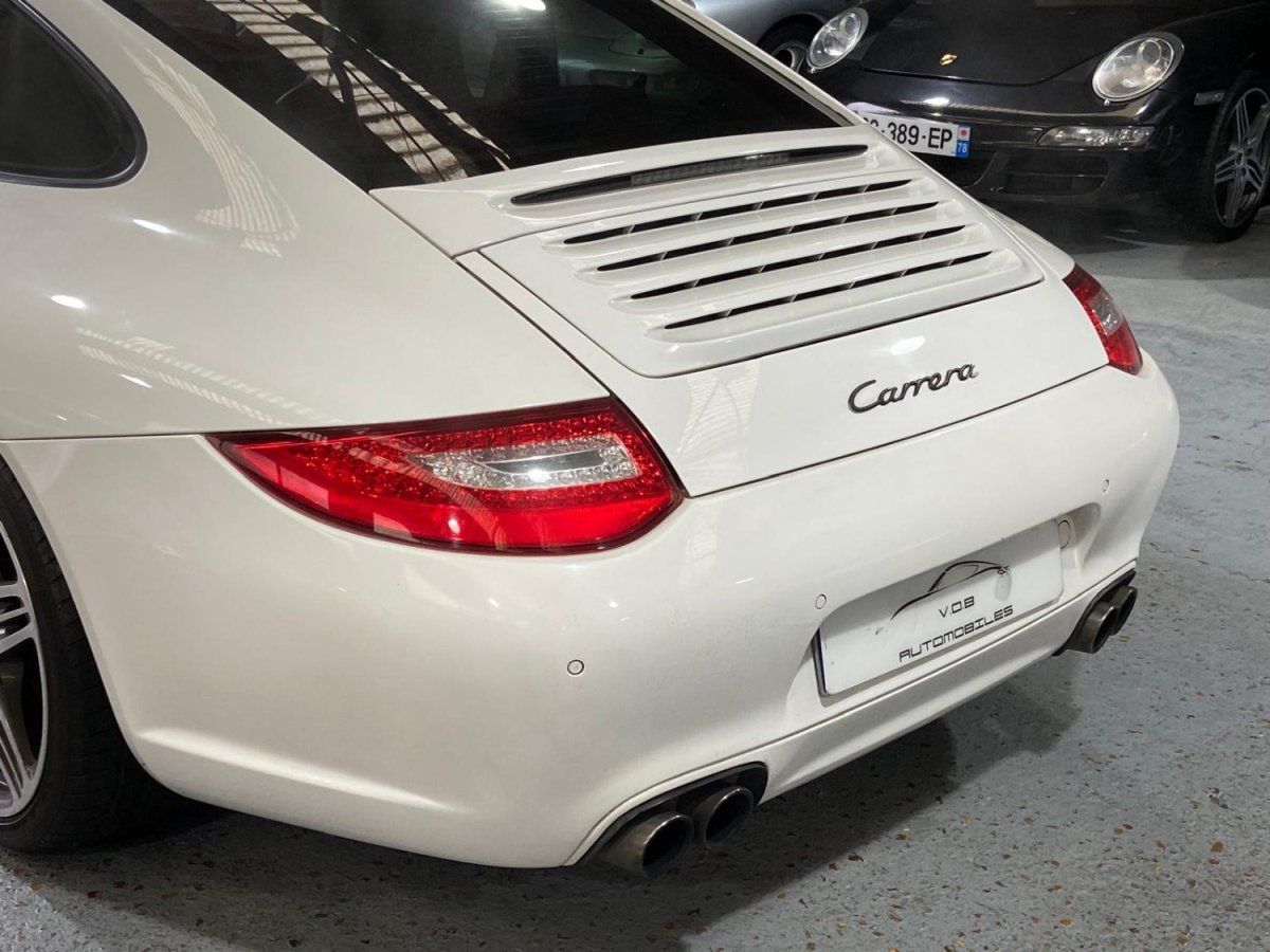 Porsche 997 Carrera 2009 — vue arriere trois-quarts (15)