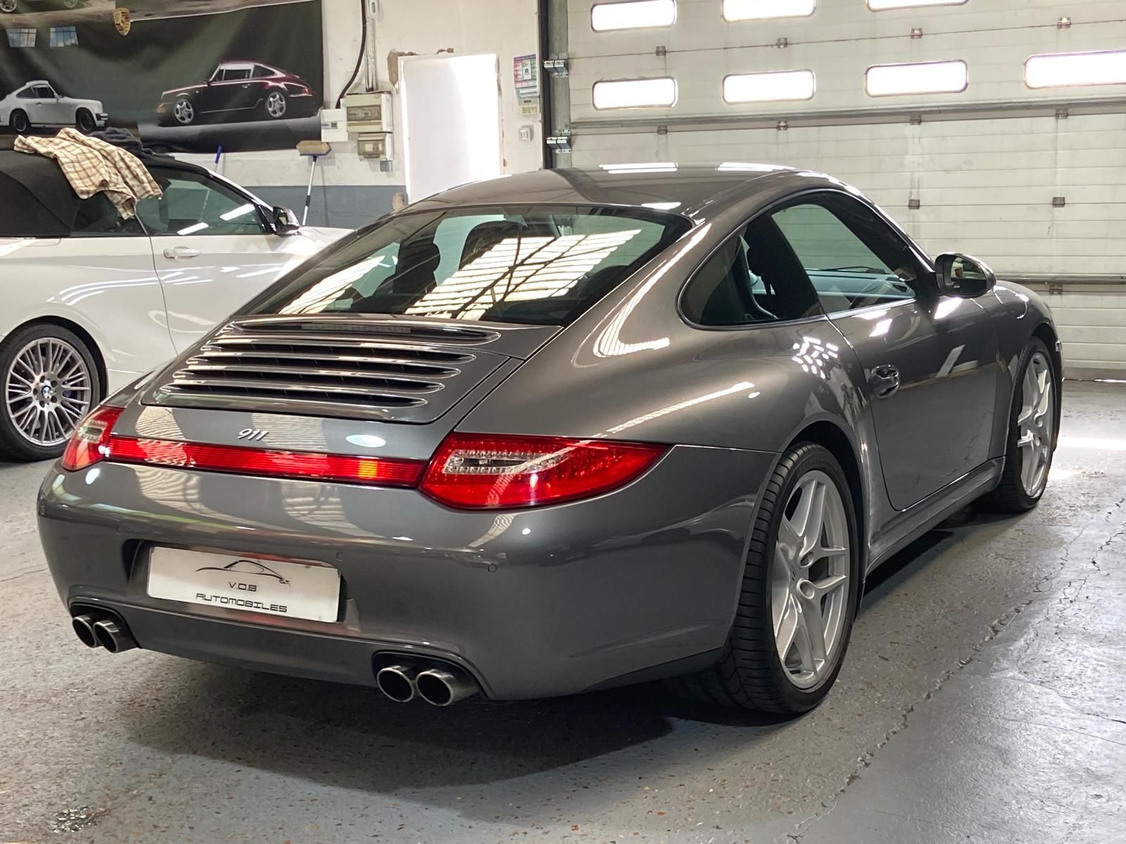 Porsche 997 Carrera 4 2011 — vue arriere trois-quarts (18)