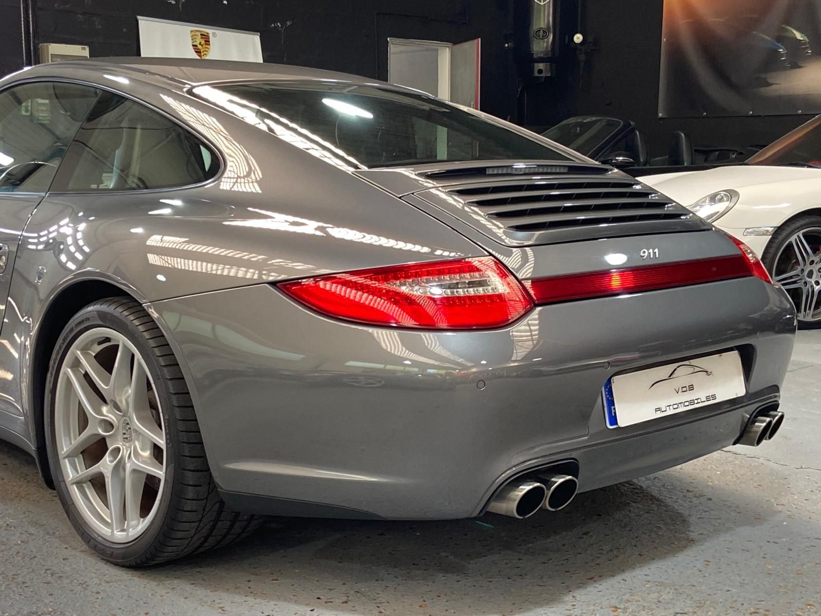 Porsche 997 Carrera 4 2011 — vue arriere trois-quarts (19)