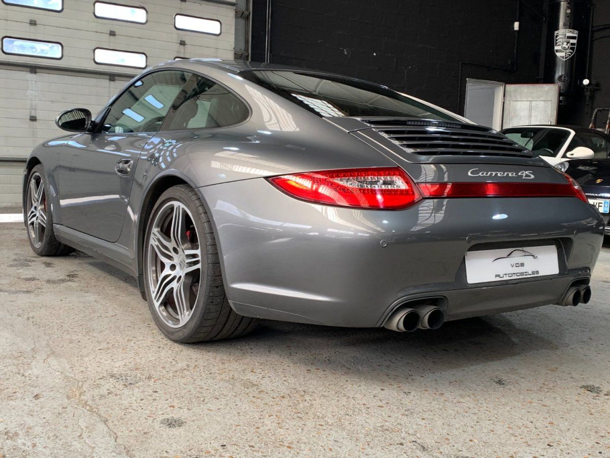 Porsche 997 Carrera 4S 2009 — vue arriere trois-quarts (11)