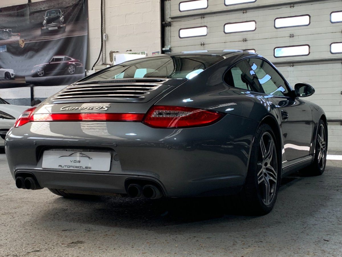 Porsche 997 Carrera 4S 2009 — vue arriere trois-quarts (12)