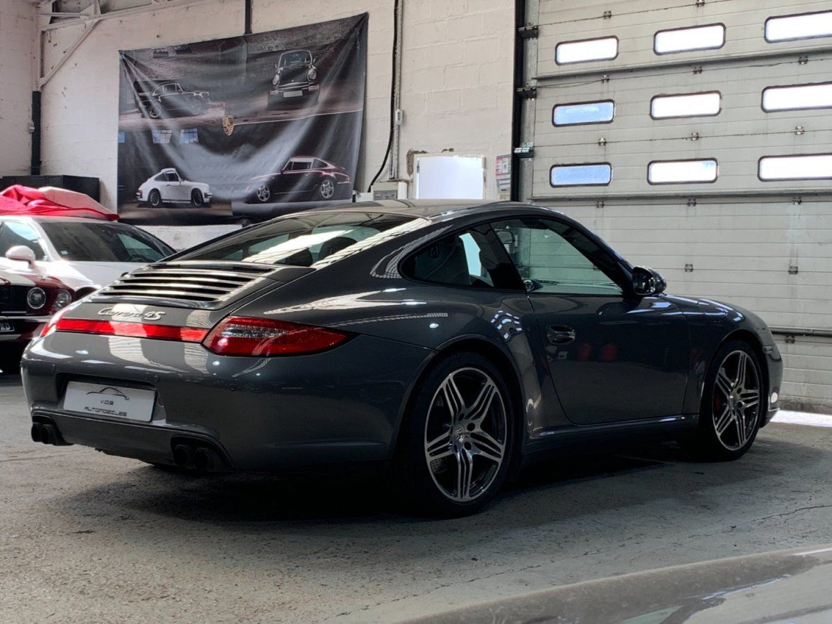 Porsche 997 Carrera 4S 2009 — vue arriere trois-quarts (13)