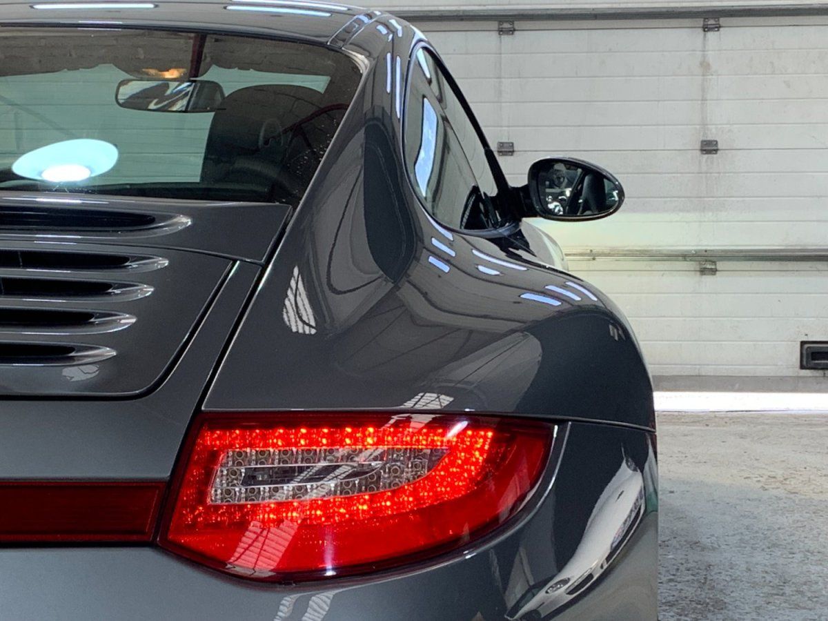 Porsche 997 Carrera 4S 2009 — vue arriere trois-quarts (14)