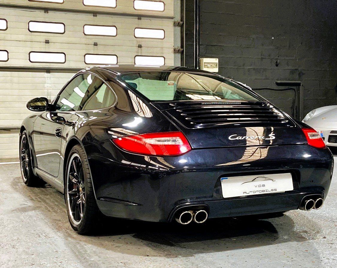 Porsche 997 Carrera S 2009 — vue arriere trois-quarts (11)