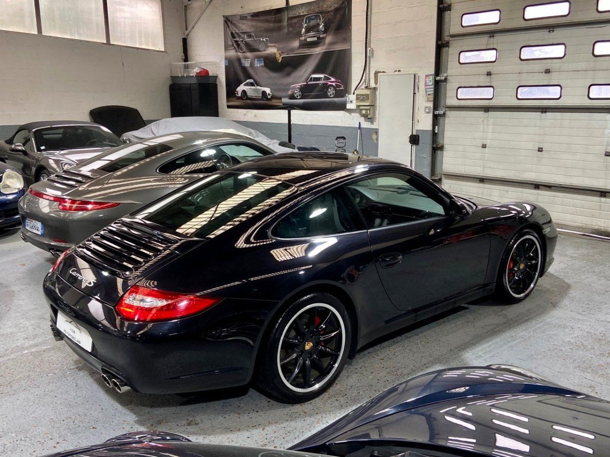 Porsche 997 Carrera S 2009 — vue arriere trois-quarts (13)