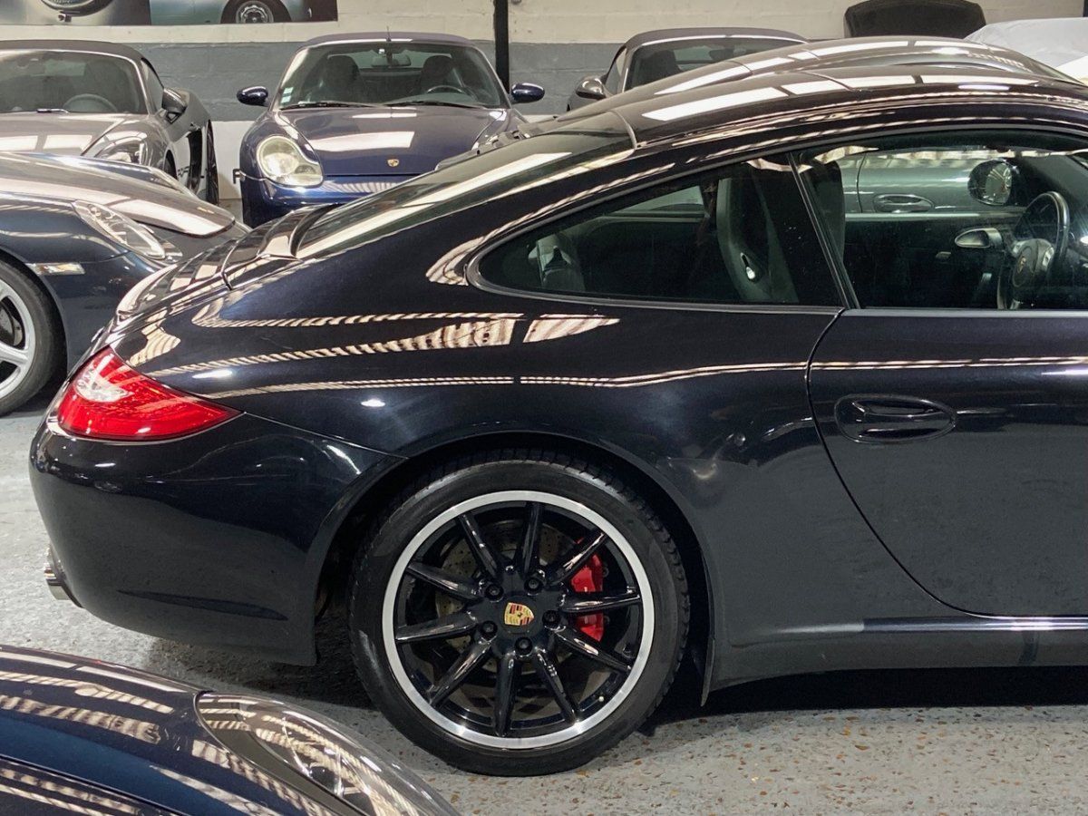 Porsche 997 Carrera S 2009 — vue arriere trois-quarts (14)