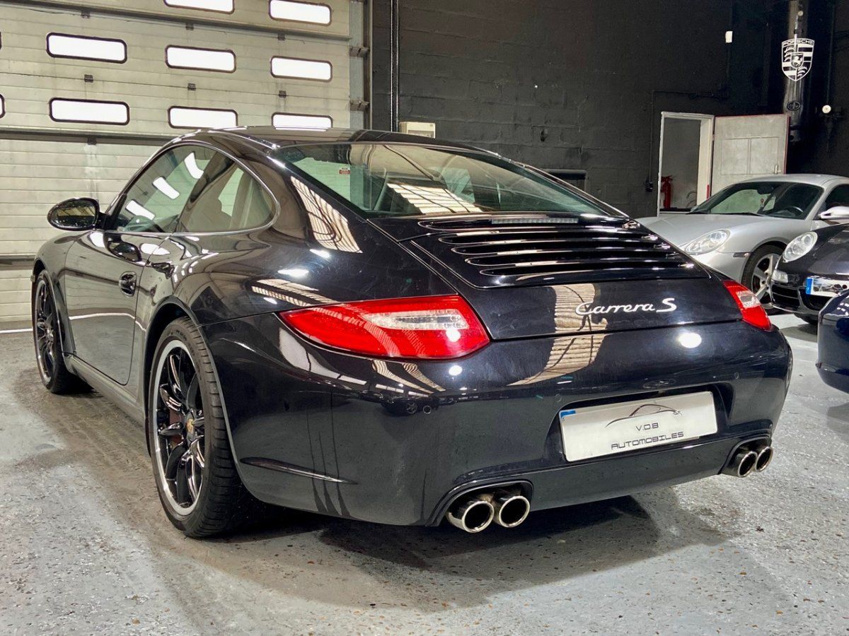 Porsche 997 Carrera S 2009 — vue arriere trois-quarts (16)