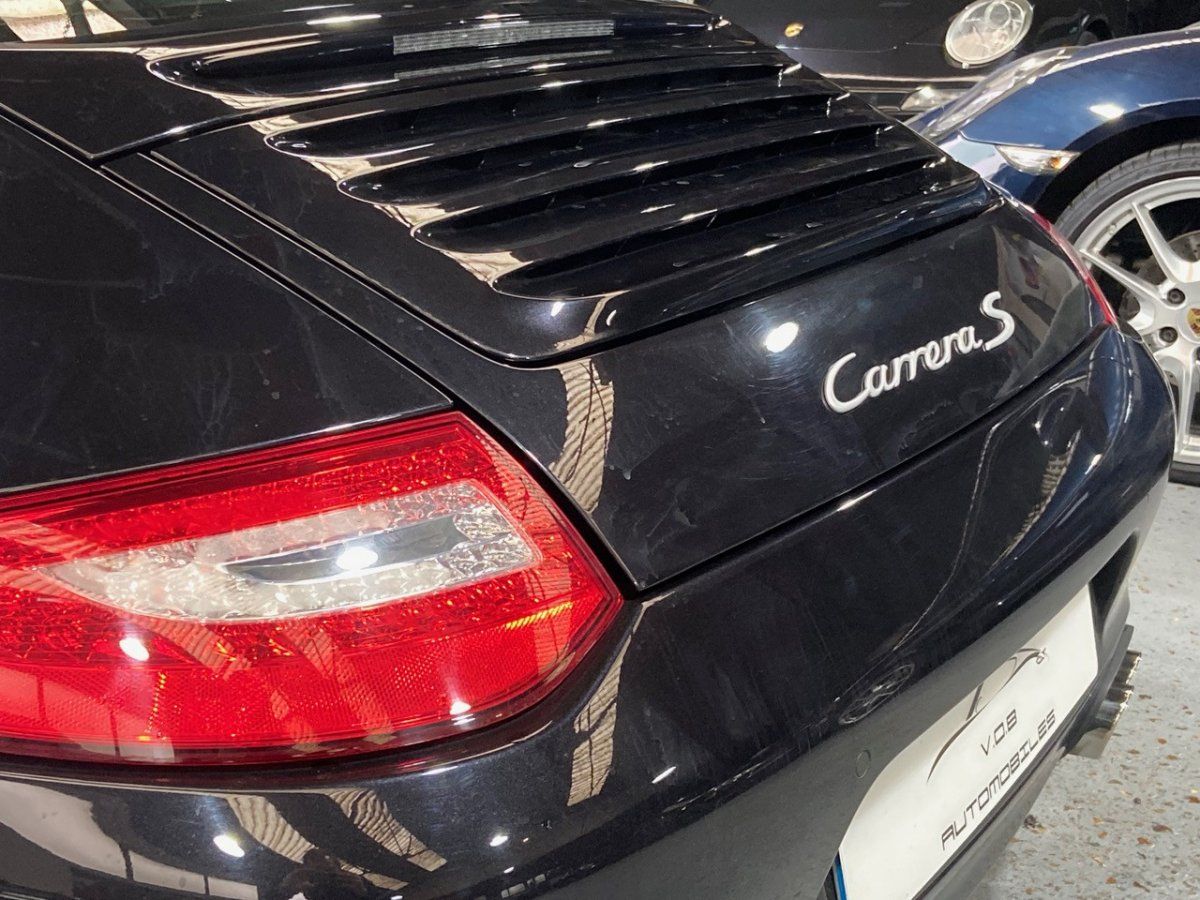 Porsche 997 Carrera S 2009 — vue arriere trois-quarts (17)
